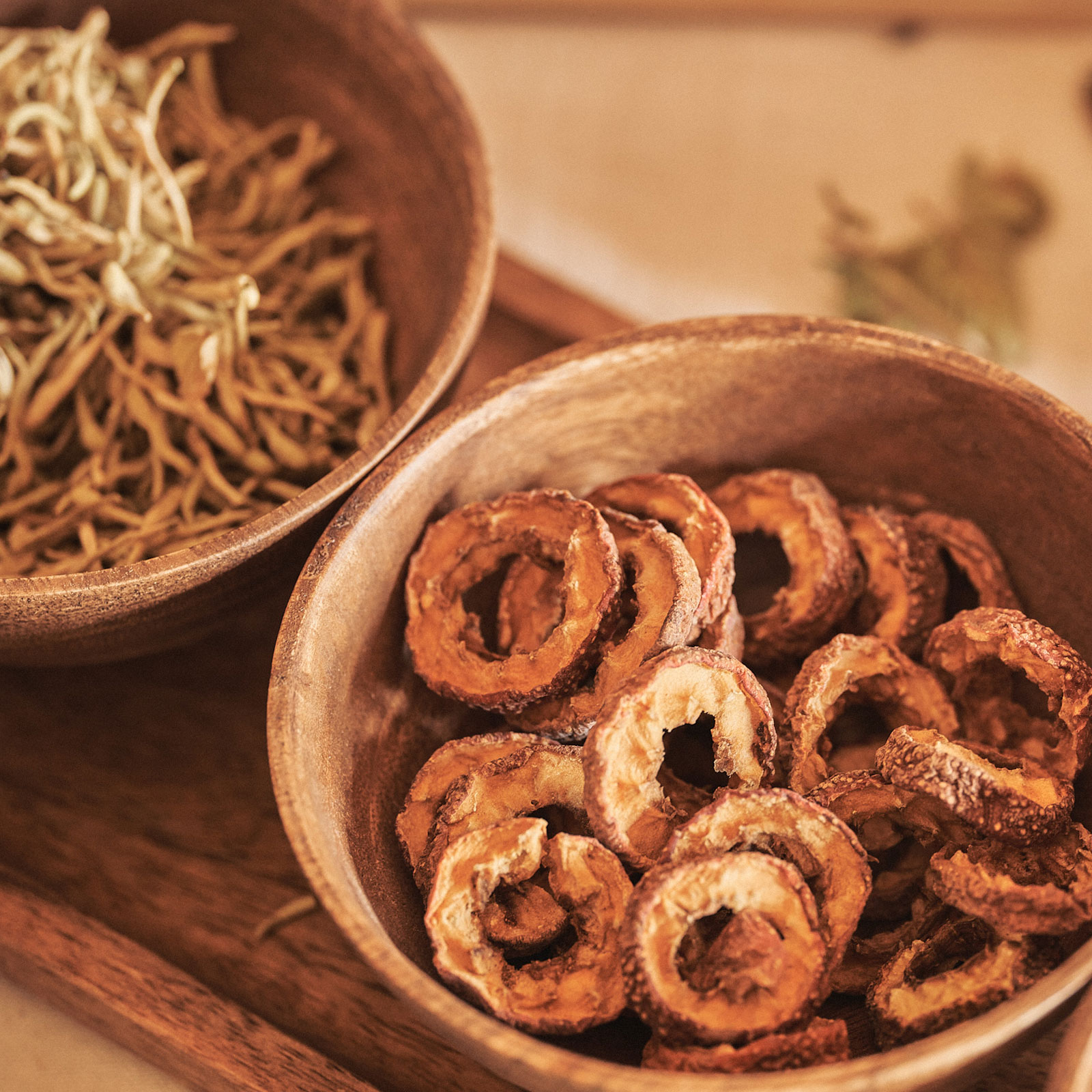 A selection of dried Traditional Chinese herbs, including ginseng, astragalus, and licorice for holistic healing